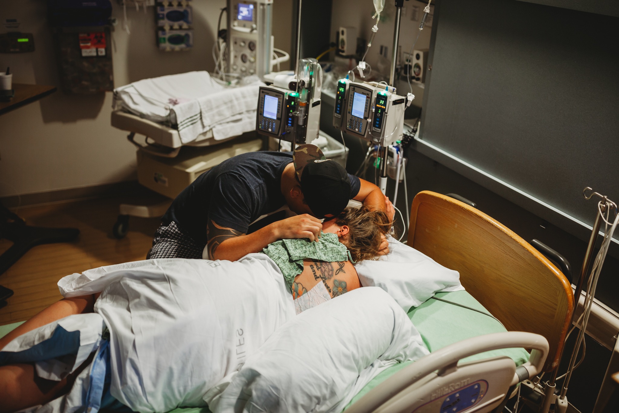 Partner supports woman during labor and birth at a Los Angeles hospital.