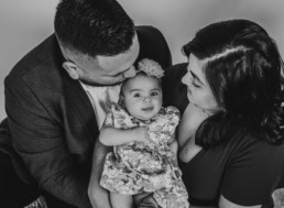 Photography of family snuggling new baby