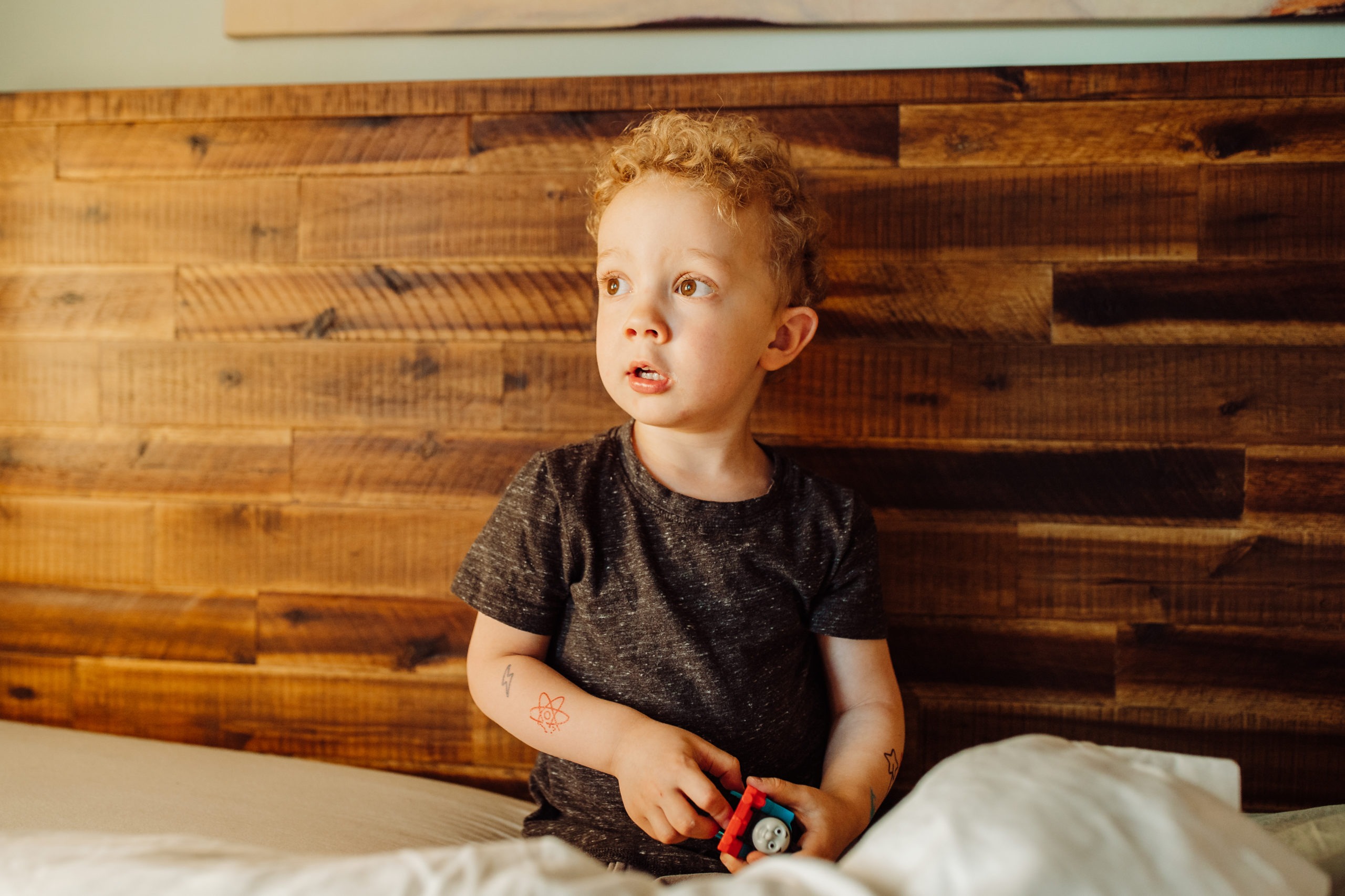 Lifestyle photos of child in home on bed